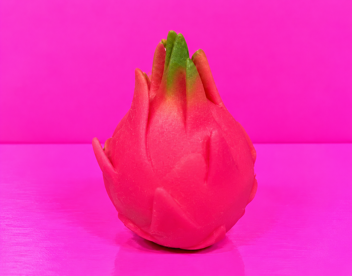 Dragon fruit squishy on pink table and background