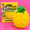 Jumbo scented pineapple SoftMart squishy and box on pink table